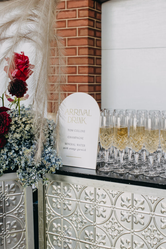 Close up of silver bar with arrival drink in crystal glassware